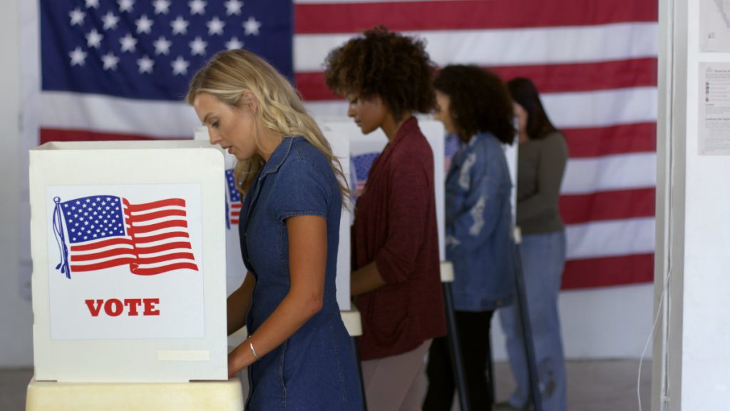 four women of various demographics, young blonde woman in front,